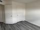 Bright bedroom featuring hard surface floors, closet, and neutral paint at 4555 E Sahara Ave # 288, Las Vegas, NV 89104