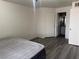 Bedroom with wood-style flooring and ensuite bathroom access at 4555 E Sahara Ave # 288, Las Vegas, NV 89104