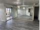 Spacious living room featuring stylish flooring, natural light, a sliding glass door and mirrored wall at 4555 E Sahara Ave # 288, Las Vegas, NV 89104