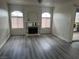 Open-concept living room boasting modern flooring, a fireplace, and access to the balcony at 4555 E Sahara Ave # 288, Las Vegas, NV 89104