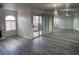 A spacious living room with modern flooring, natural light, and large mirrored wall at 4555 E Sahara Ave # 288, Las Vegas, NV 89104