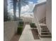 Outside walkway view displaying access to upper level with shrubs and well kept landscaping at 4555 E Sahara Ave # 288, Las Vegas, NV 89104