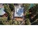 An aerial view of the home showing multiple decks and surrounding treed community at 4778 Knotty Pine Way, Las Vegas, NV 89124