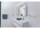 Bathroom featuring double sink vanity, hexagon tile floors, and modern lighting fixtures at 4778 Knotty Pine Way, Las Vegas, NV 89124