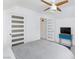 This bedroom features neutral tones, a ceiling fan, and a stylish blue accent table at 4778 Knotty Pine Way, Las Vegas, NV 89124