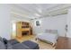 Open floorplan living and bedroom features a sauna and a plush grey sectional couch at 4778 Knotty Pine Way, Las Vegas, NV 89124