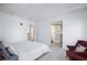 Bright bedroom with ensuite bathroom and walk-in closet, sleek minimalist design, and hardwood-style floors at 4778 Knotty Pine Way, Las Vegas, NV 89124