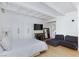 Open floorplan living and bedroom features a lounge space and sleeping space, ample storage, and modern furniture at 4778 Knotty Pine Way, Las Vegas, NV 89124
