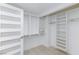 Walk-in closet with custom shelving and hanging rods, offering ample storage at 4778 Knotty Pine Way, Las Vegas, NV 89124