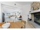 Bright dining area connects to a living space with a fireplace, stylish furniture, and a spacious layout at 4778 Knotty Pine Way, Las Vegas, NV 89124