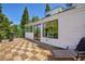View of exterior of the house with a deck, windows, and mountain view at 4778 Knotty Pine Way, Las Vegas, NV 89124