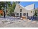 Charming white home with A-frame roof, covered porch, stone paver driveway, and basketball hoop at 4778 Knotty Pine Way, Las Vegas, NV 89124
