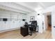 Bright home office with built in storage shelves, hardwood floors and modern lighting fixtures at 4778 Knotty Pine Way, Las Vegas, NV 89124