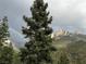 Scenic view of a rainbow over the mountains with lush greenery at 4778 Knotty Pine Way, Las Vegas, NV 89124