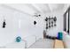 Bright mud room with white walls, built-in storage, and ski equipment racks at 4778 Knotty Pine Way, Las Vegas, NV 89124