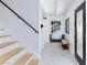Bright mud room featuring a black trimmed front door, built-in bench, and ski storage at 4778 Knotty Pine Way, Las Vegas, NV 89124