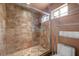Bathroom featuring a walk-in shower with glass door, plus shelving for storage at 4830 Silver Tip Way, Mount Charleston, NV 89124