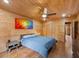 Bedroom offers a queen bed, hardwood floors, closet, and accent art at 4830 Silver Tip Way, Mount Charleston, NV 89124
