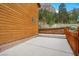 Log cabin with a concrete patio and a wood fence with mountain views at 4830 Silver Tip Way, Mount Charleston, NV 89124
