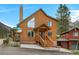Charming wood home with inviting front porch and stairs, located on corner lot near mountain at 4830 Silver Tip Way, Mount Charleston, NV 89124
