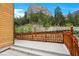 Log cabin with a concrete patio and a wood fence with mountain views at 4830 Silver Tip Way, Mount Charleston, NV 89124