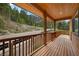 Inviting log cabin home featuring a wood porch with views of the mountains at 4830 Silver Tip Way, Mount Charleston, NV 89124