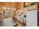 Bright kitchen with wood cabinets, tile backsplash, and island, perfect for cooking at 4830 Silver Tip Way, Mount Charleston, NV 89124