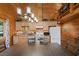 Well-lit kitchen with wood cabinets, stone countertops, and modern appliances for meal preparation at 4830 Silver Tip Way, Mount Charleston, NV 89124