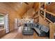 Spacious living room features an open floor plan, wood paneled walls, and a high ceiling at 4830 Silver Tip Way, Mount Charleston, NV 89124