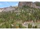 Scenic mountain view with a charming cabin nestled amidst lush trees at 4830 Silver Tip Way, Mount Charleston, NV 89124
