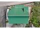 Close-up aerial view of a well-maintained green roof on a charming mountain cabin with a cozy patio at 4830 Silver Tip Way, Mount Charleston, NV 89124