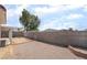 The backyard has plenty of room for entertaining and activities, and is surrounded by a privacy wall at 521 Landra Ln, Henderson, NV 89015
