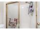 The bathroom features a glass door shower with a silver towel and storage rack at 521 Landra Ln, Henderson, NV 89015