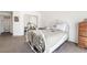 Neutral-toned bedroom features a large mirror door closet, a bed and a dresser at 521 Landra Ln, Henderson, NV 89015