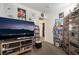 A cozy bedroom with ample storage and entertainment space, featuring decor and personal touches at 521 Landra Ln, Henderson, NV 89015