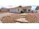 Charming single-story home featuring a two-car garage and low maintenance desert landscaping at 521 Landra Ln, Henderson, NV 89015