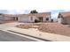 Charming single-story home featuring a two-car garage and low maintenance desert landscaping at 521 Landra Ln, Henderson, NV 89015