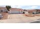 Charming single-story home featuring a two-car garage and low maintenance desert landscaping at 521 Landra Ln, Henderson, NV 89015