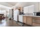 Cozy kitchen features updated appliances, bright lighting, and plenty of cabinet space at 521 Landra Ln, Henderson, NV 89015
