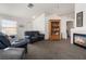Bright living room with vaulted ceilings and carpet flooring at 521 Landra Ln, Henderson, NV 89015