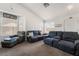 Bright living room with vaulted ceilings and carpet flooring at 521 Landra Ln, Henderson, NV 89015