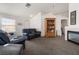 Bright living room with vaulted ceilings and carpet flooring at 521 Landra Ln, Henderson, NV 89015