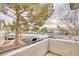 Balcony view of a well-maintained complex including trees, parking, and multi-Gathering units at 5265 Caspian Springs Dr # 201, Las Vegas, NV 89120