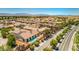 Aerial view of the house in a neighborhood featuring a pool and landscaped backyard at 5396 Splendido Ave, Pahrump, NV 89061