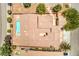 Bird's eye view of home's roof, pool, garden, driveway, and surrounding neighborhood at 5396 Splendido Ave, Pahrump, NV 89061