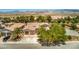 Aerial view of the home shows a well maintained yard, desert landscape, and mountain views at 5396 Splendido Ave, Pahrump, NV 89061
