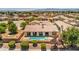 Backyard featuring a sparkling pool, covered patio, and landscaped garden with mature trees at 5396 Splendido Ave, Pahrump, NV 89061