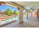 Covered patio with view of backyard pool and spa at 5396 Splendido Ave, Pahrump, NV 89061