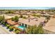 Home aerial view highlighting pool, covered patio, and landscaped yard with mature trees at 5396 Splendido Ave, Pahrump, NV 89061