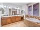 A Primary bathroom featuring double sinks, a soaking tub, and a separate shower at 5396 Splendido Ave, Pahrump, NV 89061